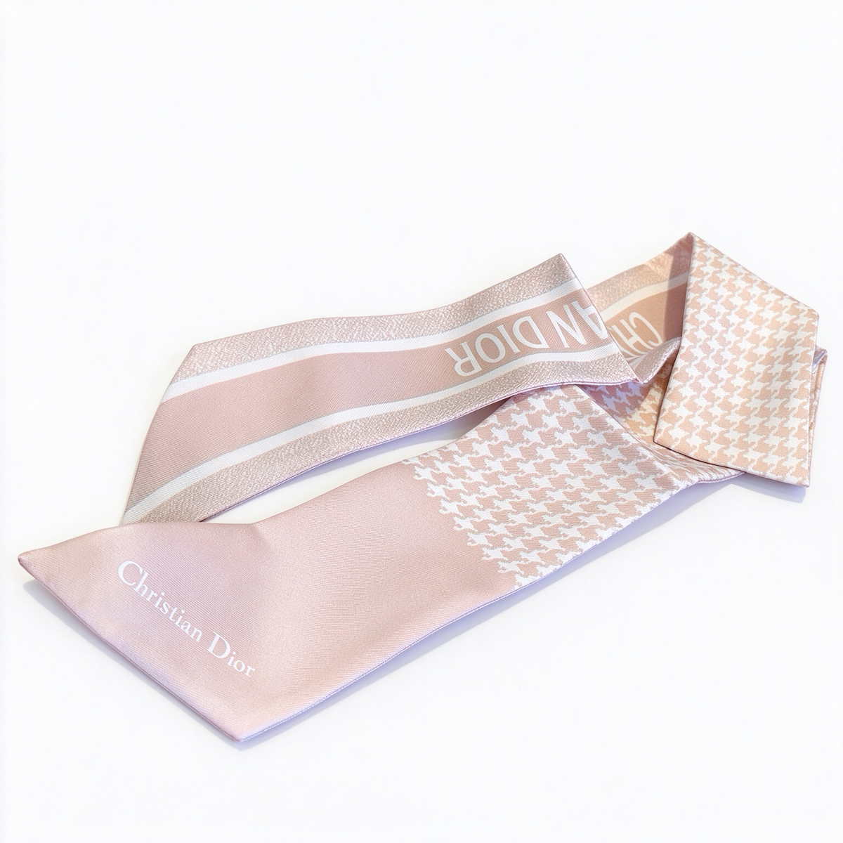Dior-style Mitzah slim silk scarf—a long, pale pink houndstooth-patterned scarf; a luxury French designer-inspired accessory for women.