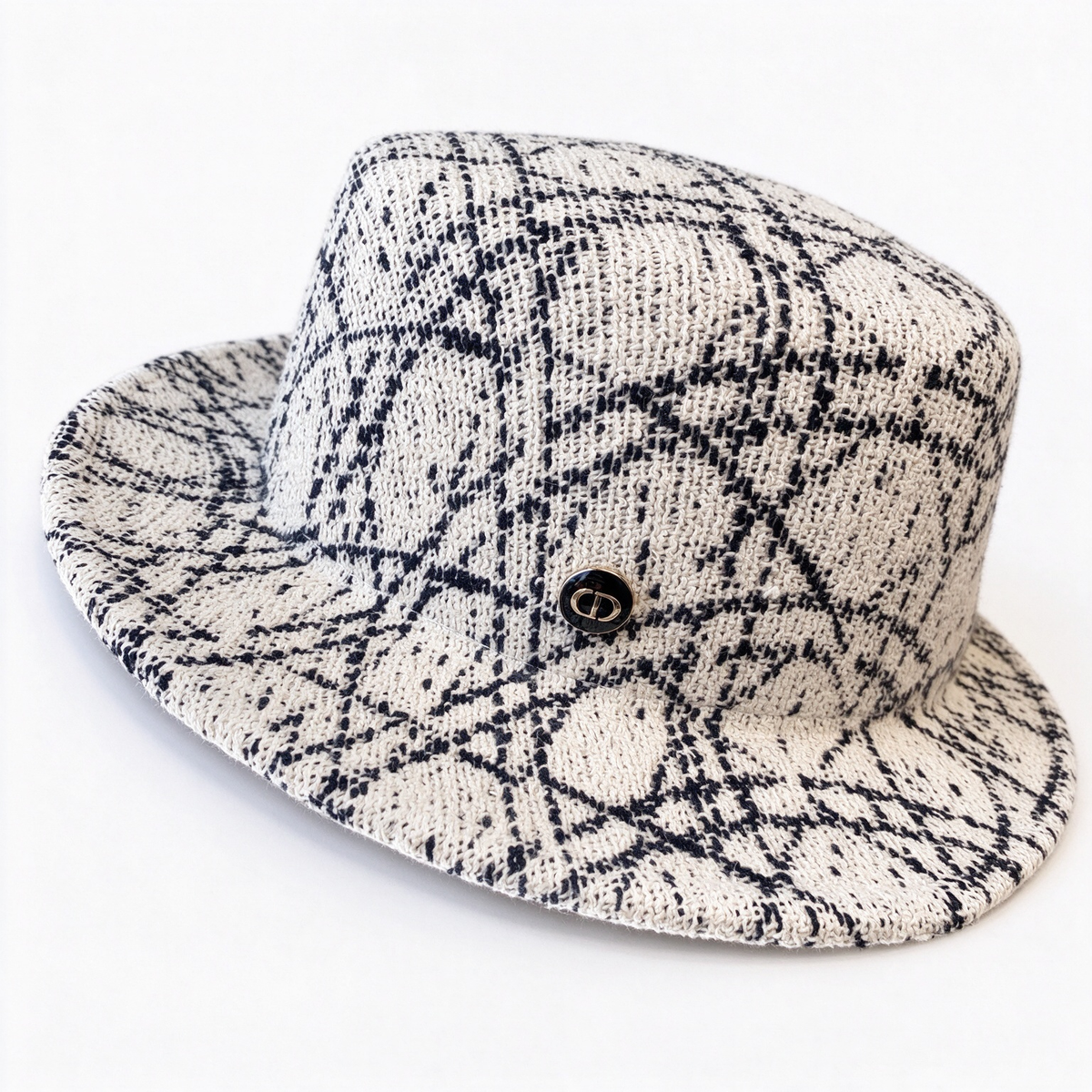 Dior Oblique Jacquard Bucket Hat — a navy blue and beige cotton-blend bucket hat, featuring a metal 'CD' buckle;