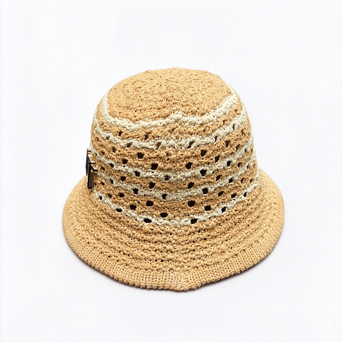 Dior-style crocheted raffia bucket hat—crafted from natural beige raffia in an open-weave pattern, featuring a black, metallic-finish Dior logo.