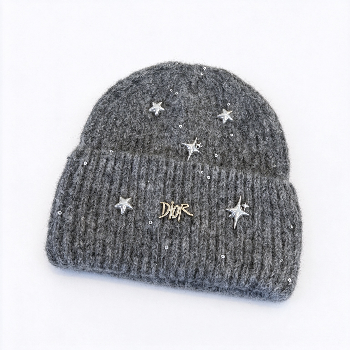 Dior "Starlight" collection sequined knit beanie—crafted from a charcoal-grey wool blend and embellished with metallic stars and a gold-tone Dior logo; a winter knit hat designed for women.