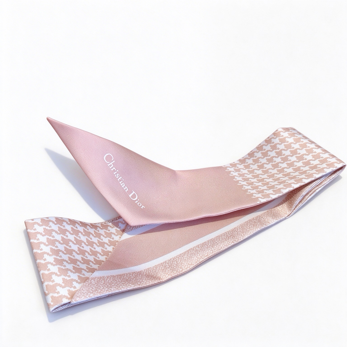 Dior-style Mitzah slim silk scarf—a long, pale pink houndstooth-patterned scarf; a luxury French designer-inspired accessory for women.